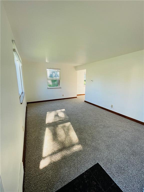 8149 Peebles Road Pittsburgh, PA 15237 - Photo 14 of 36 an empty room with wooden floor and windows