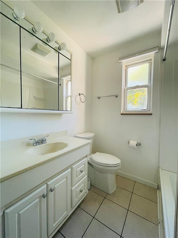 8149 Peebles Road Pittsburgh, PA 15237 - Photo 19 of 36 a bathroom with a toilet sink and mirror