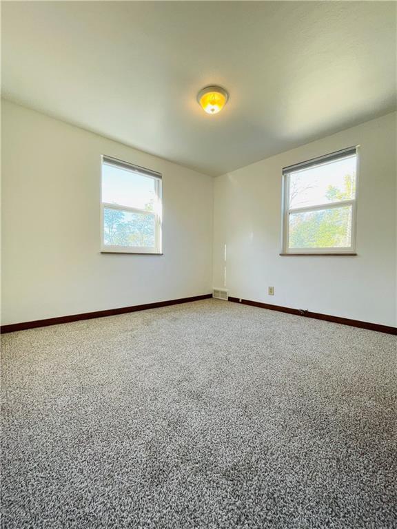 8149 Peebles Road Pittsburgh, PA 15237 - Photo 21 of 36 an empty room with a projector and a window