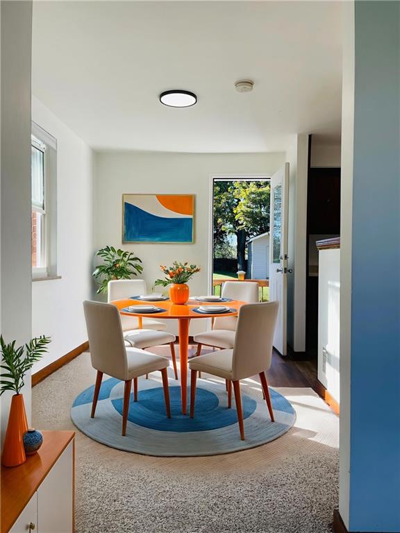 8149 Peebles Road Pittsburgh, PA 15237 - Photo 28 of 36 a dining room with furniture a rug and a potted plant