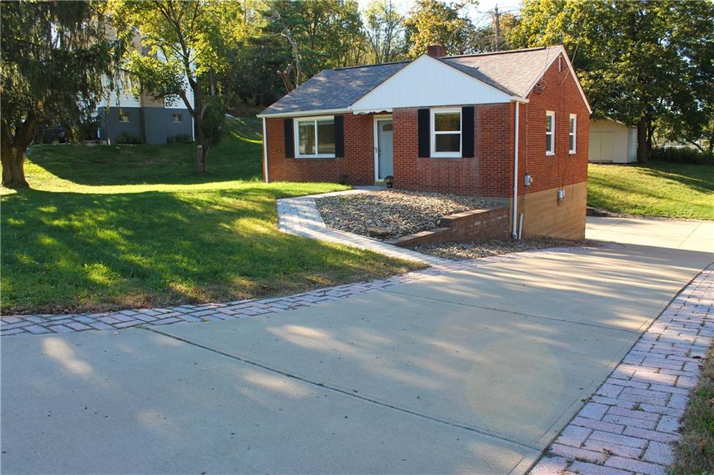 8149 Peebles Road Pittsburgh, PA 15237 - Photo 4 of 36 a front view of a house with yard