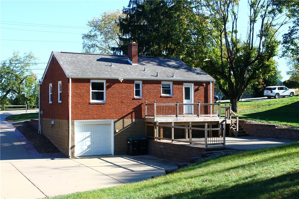 8149 Peebles Road Pittsburgh, PA 15237 - Photo 7 of 36 a front view of a house with a yard