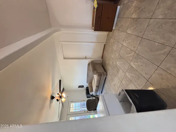a view of storage and utility room with two washing machine