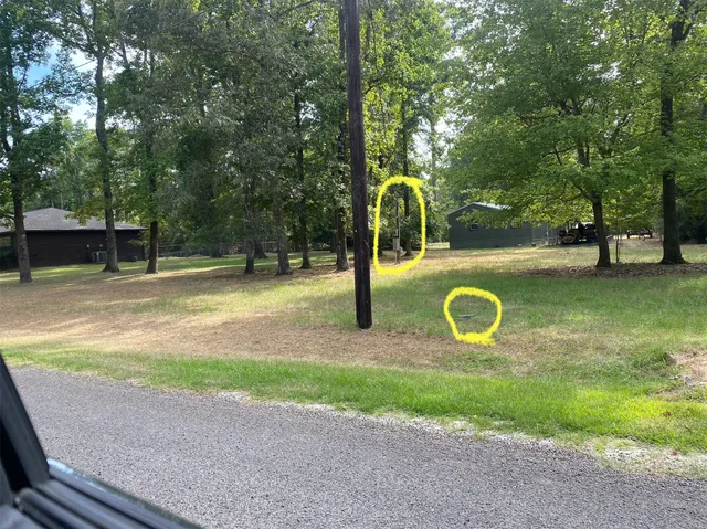 a view of a backyard with swimming pool