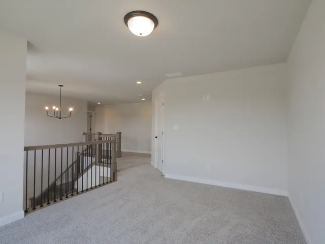 a view of an empty room with a bathroom