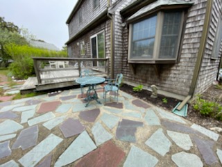 139 Surfside Road Nantucket, MA 02554 - Photo 8 of 24 a small pool with table and chairs in front of it