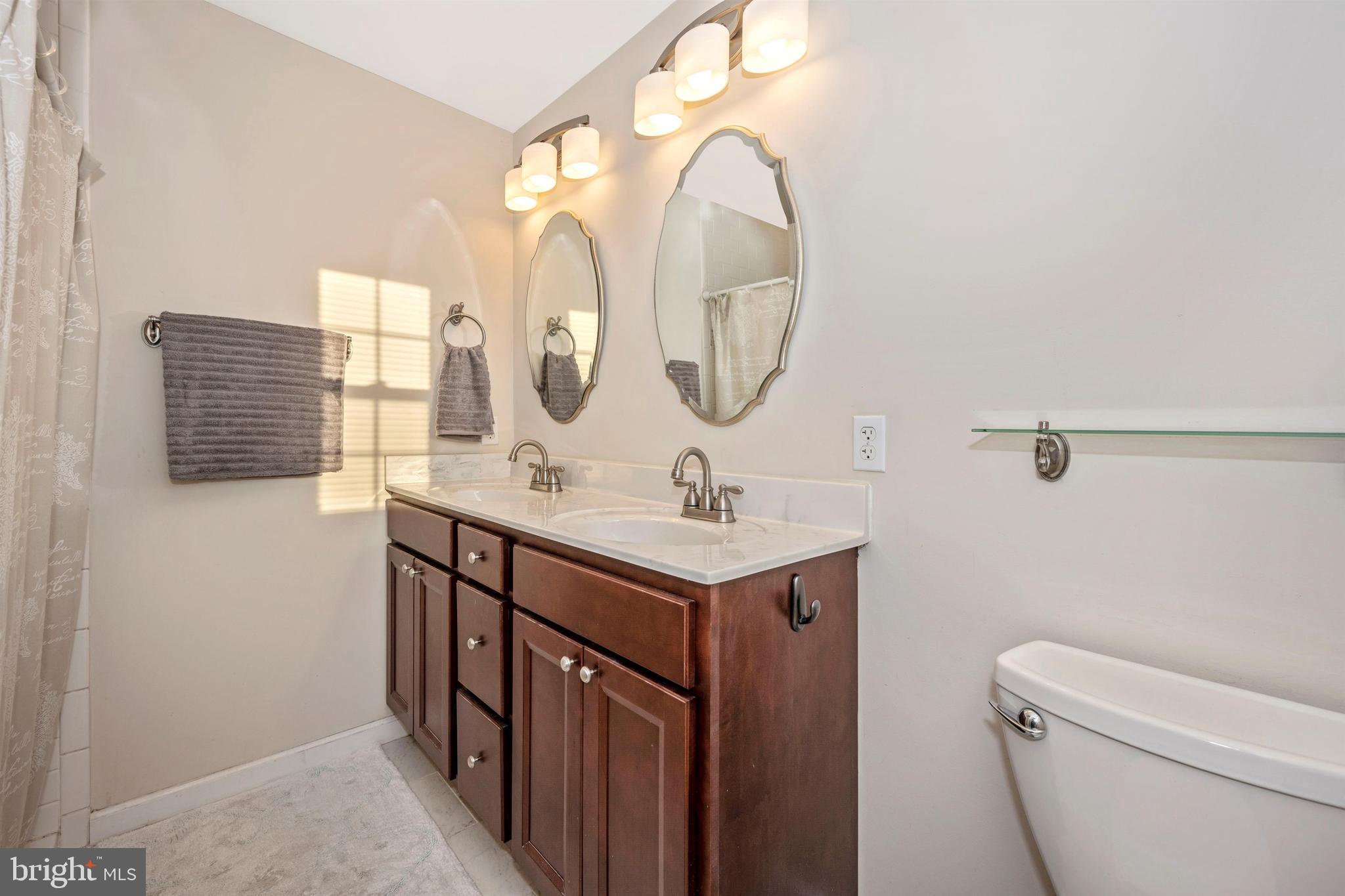12529 Fingerboard Road Monrovia, MD 21770 - Photo 31 of 55 a bathroom with a sink a toilet and a mirror