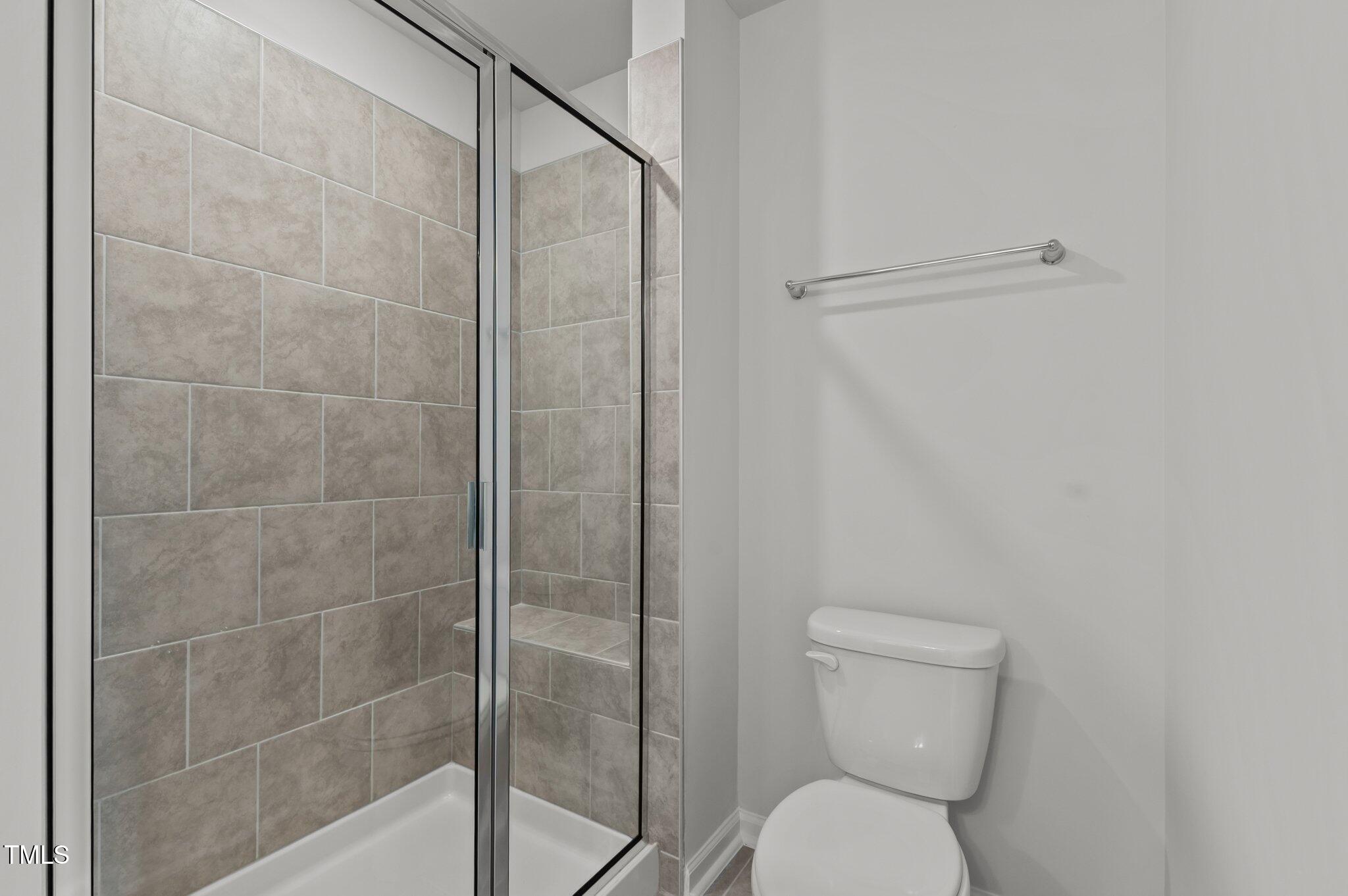 Undisclosed Address Wake Forest, NC 27587 - Photo 29 of 35 a bathroom with a toilet and a shower