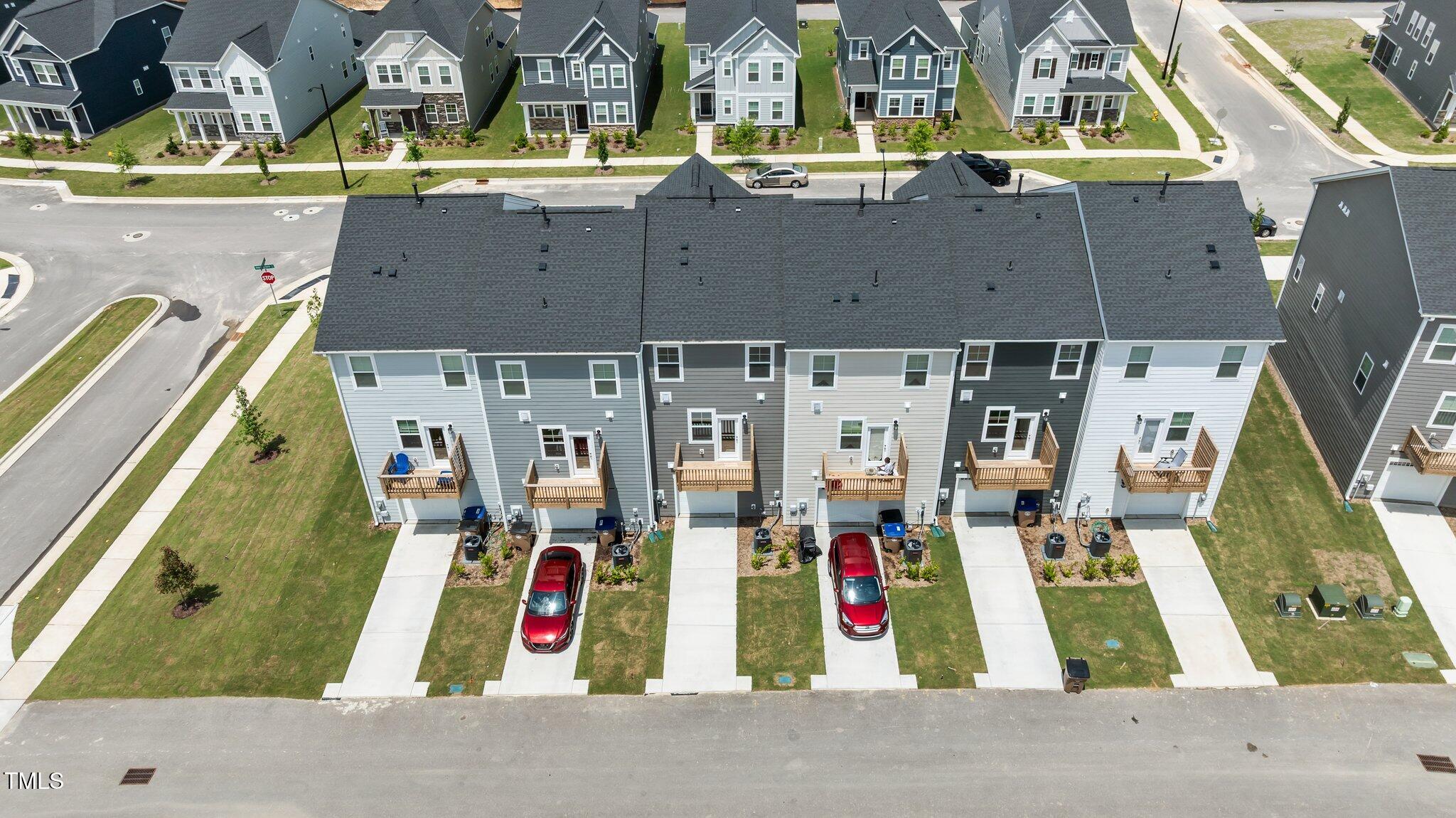 Undisclosed Address Wake Forest, NC 27587 - Photo 5 of 35 an aerial view of residential houses with outdoor space