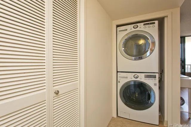 a view of a hallway with washer and dryer