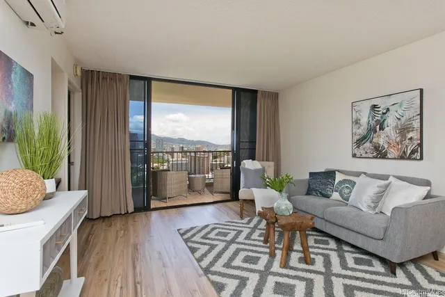 a living room with furniture and a large window