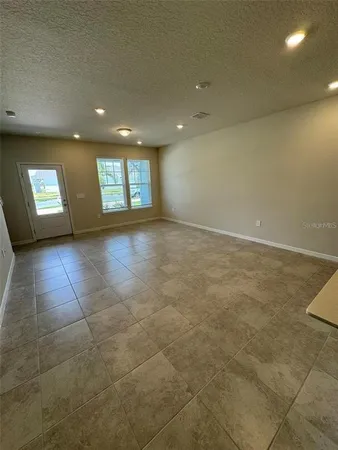 a kitchen that has a sink and a stove in it