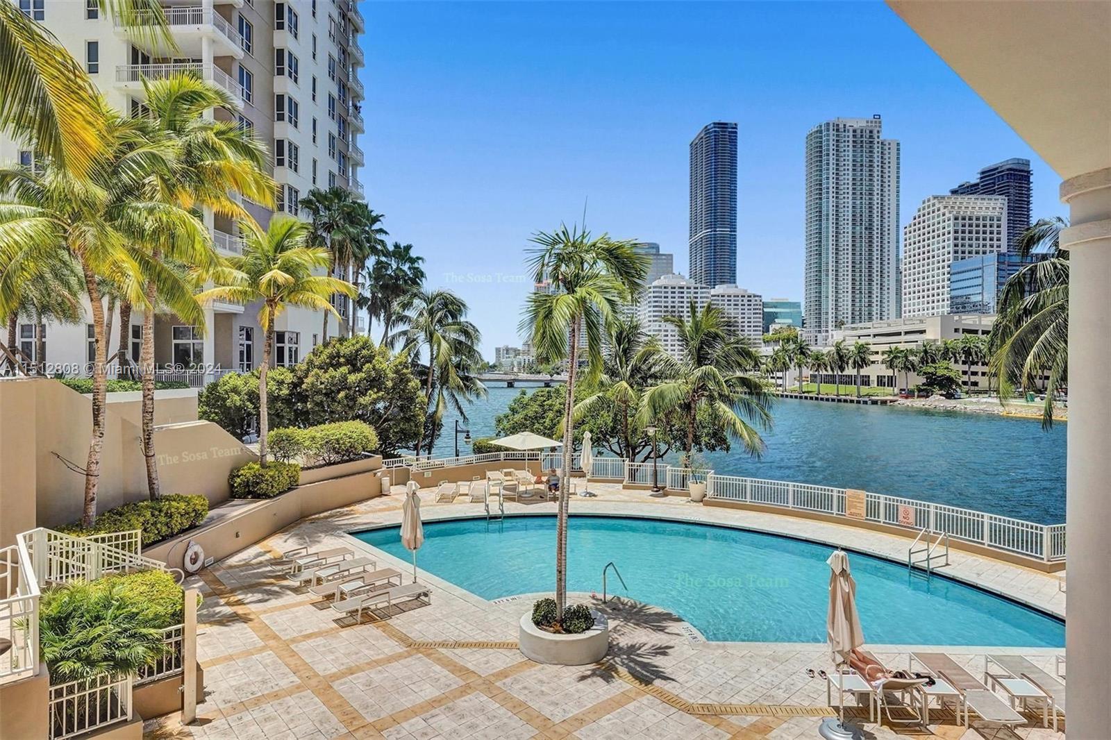 801 Brickell Key Boulevard, Unit 3004 Miami, FL 33131 - Photo 18 of 33 a view of a patio with chairs and potted plants