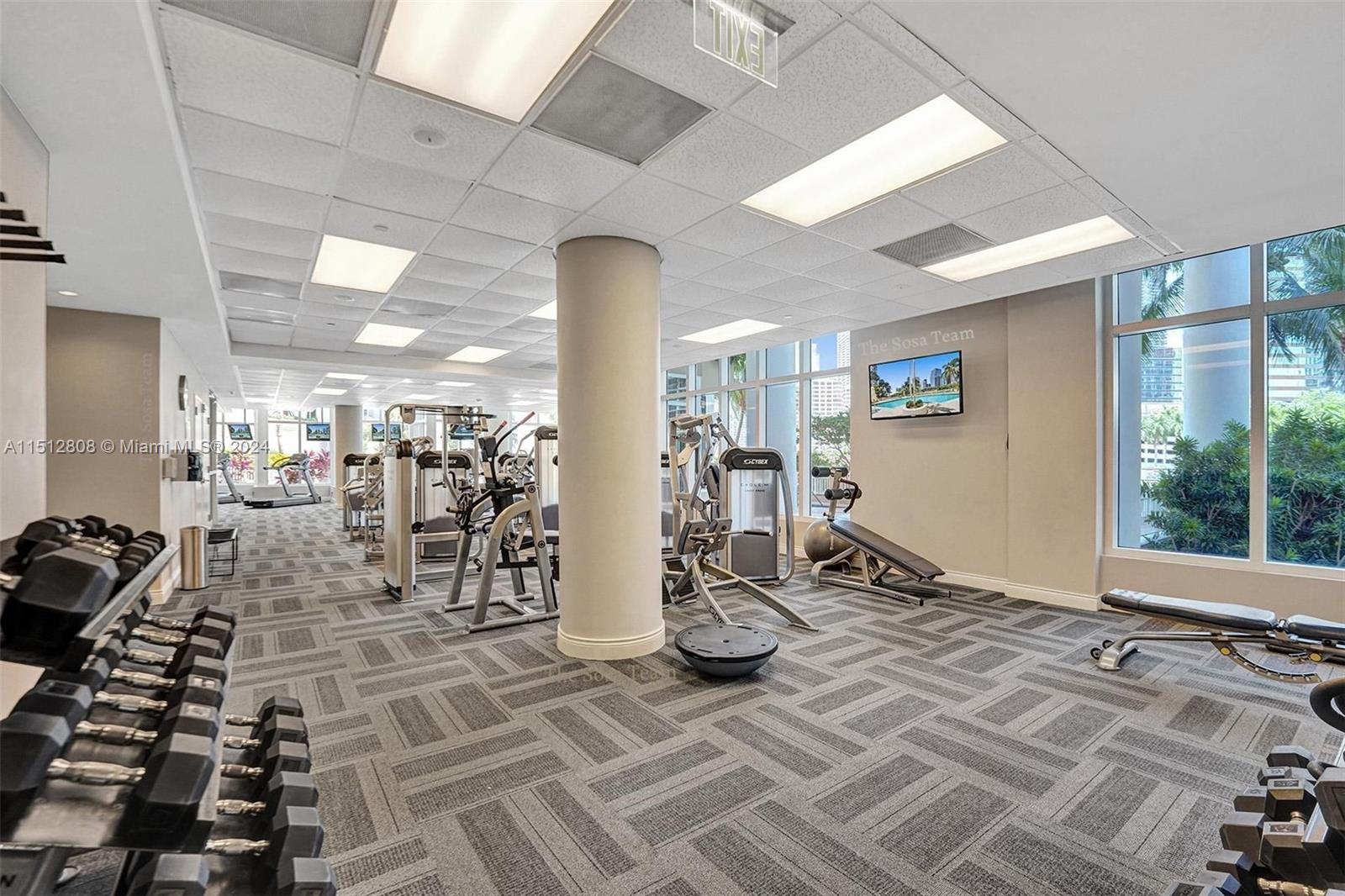 801 Brickell Key Boulevard, Unit 3004 Miami, FL 33131 - Photo 21 of 33 a view of a room with gym equipment