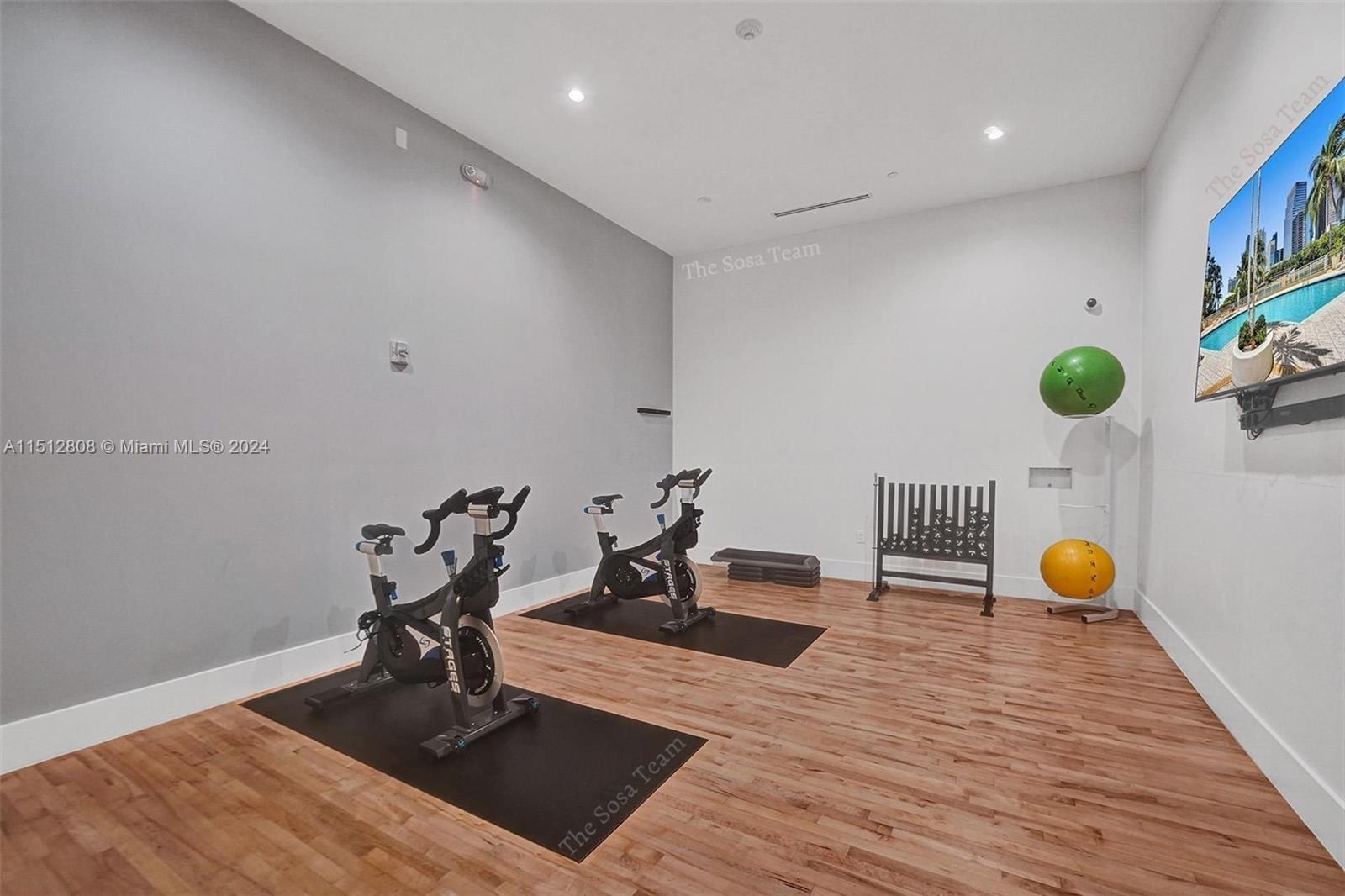 801 Brickell Key Boulevard, Unit 3004 Miami, FL 33131 - Photo 24 of 33 a living room with furniture and wooden floor