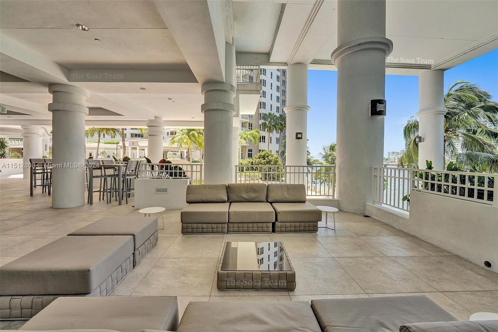 801 Brickell Key Boulevard, Unit 3004 Miami, FL 33131 - Photo 27 of 33 a living room with furniture and a table