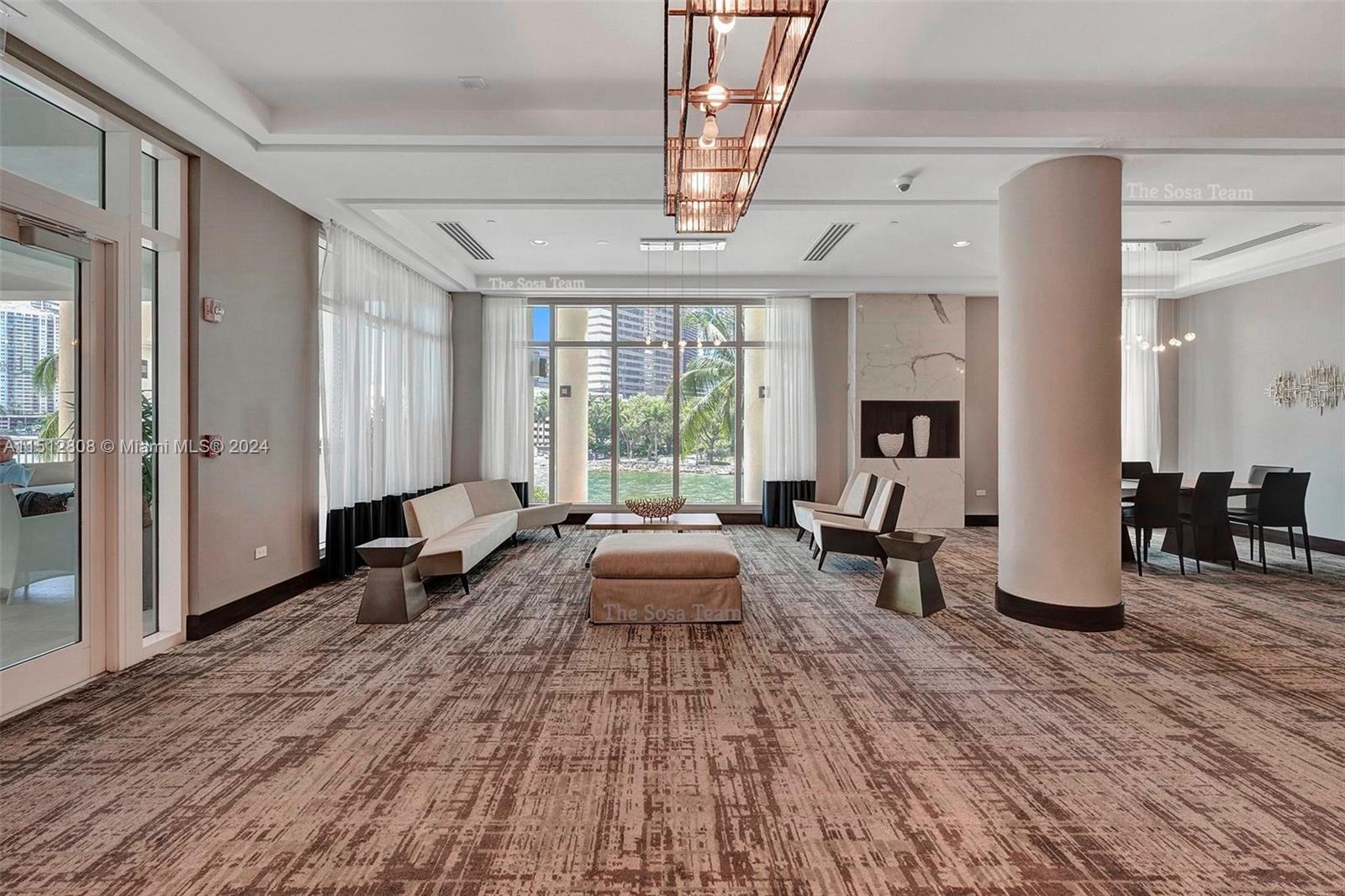 801 Brickell Key Boulevard, Unit 3004 Miami, FL 33131 - Photo 31 of 33 a living room with furniture and a large window