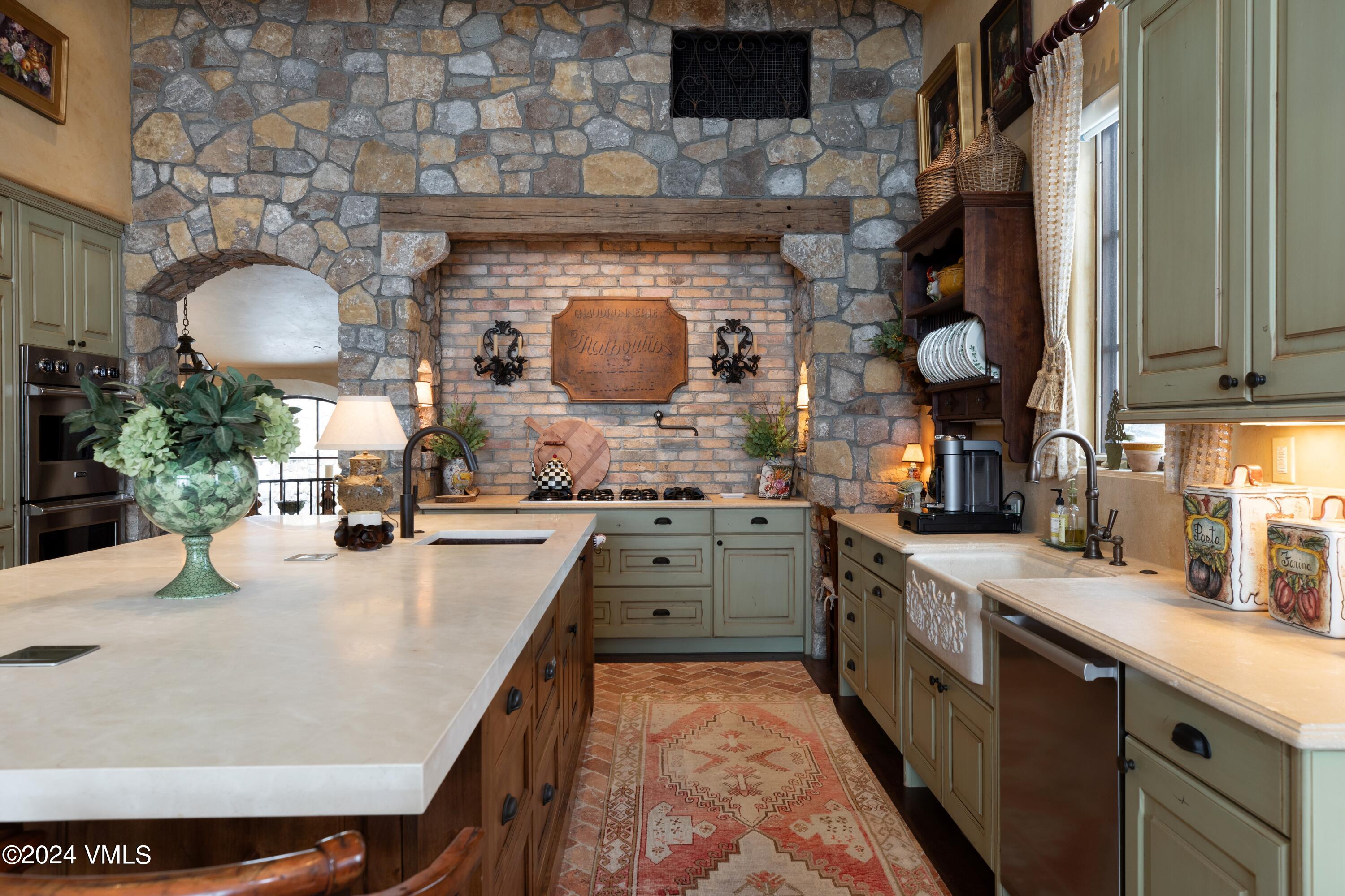 44 Jasmine Avon, CO 81620 - Photo 11 of 41 a kitchen with stainless steel appliances a stove a sink and a microwave