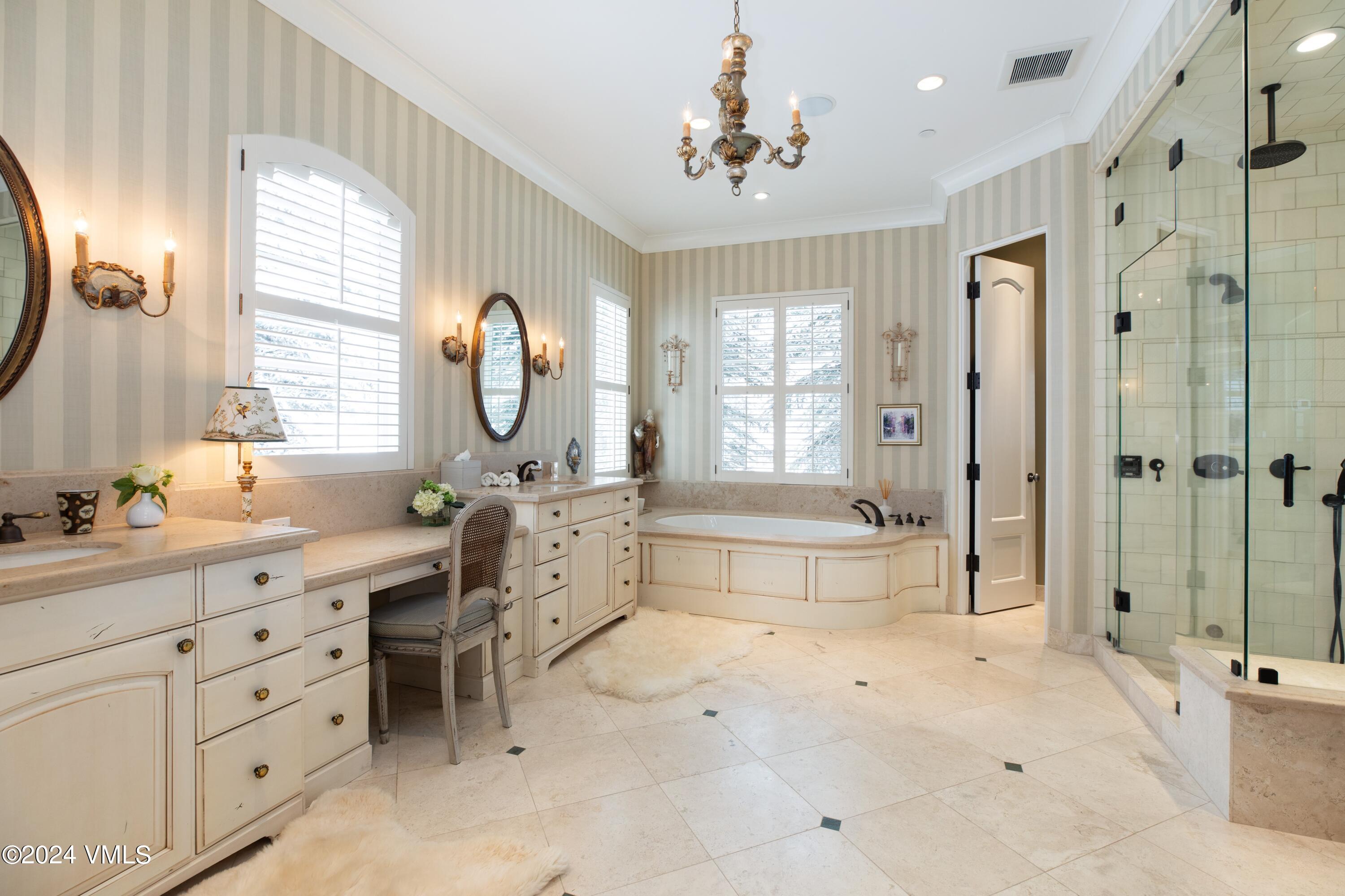 44 Jasmine Avon, CO 81620 - Photo 14 of 41 a spacious bathroom with a double vanity sink mirror and a bath tub