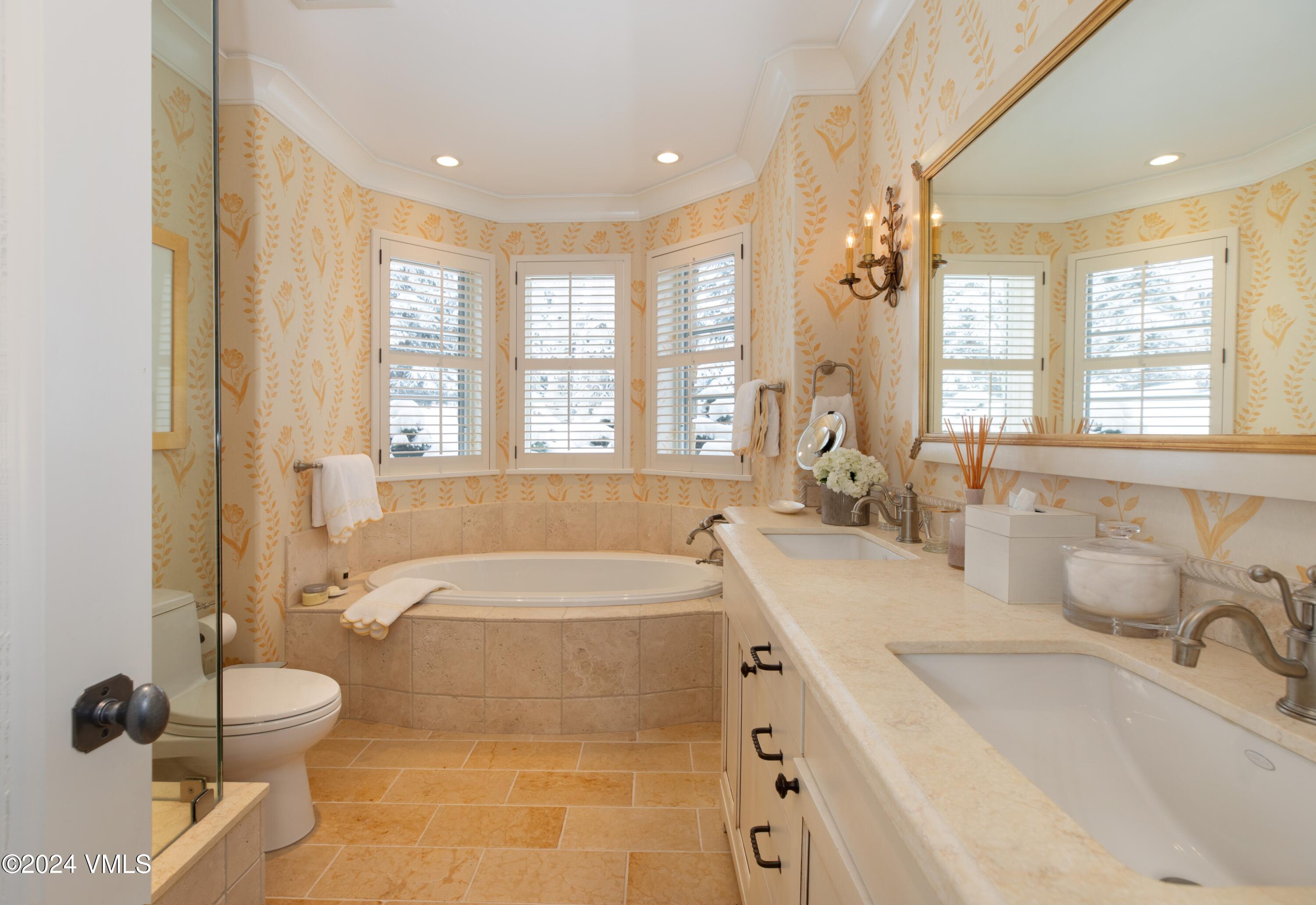 44 Jasmine Avon, CO 81620 - Photo 21 of 41 a spacious bathroom with a tub sink and mirror