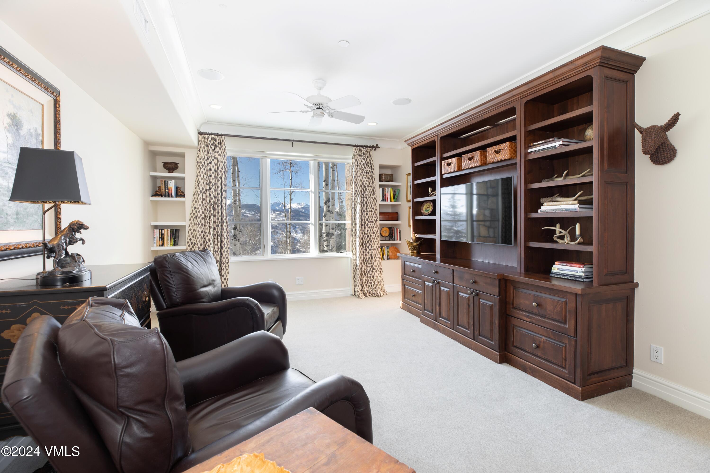 44 Jasmine Avon, CO 81620 - Photo 22 of 41 a living room with furniture cabinets and window