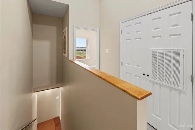 a view of a hallway with windows