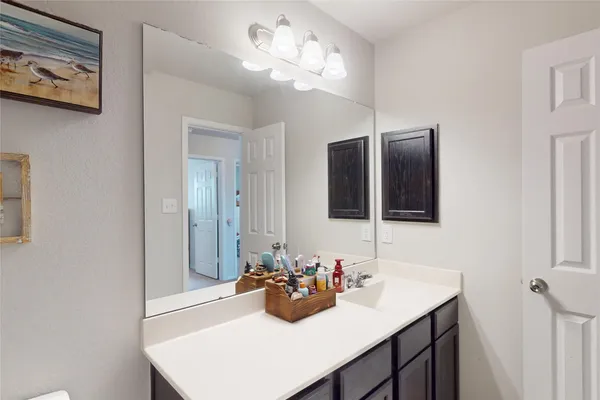 a bathroom with a sink double vanity and a mirror