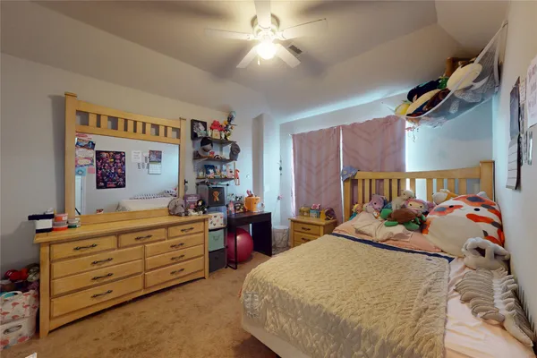 a bedroom with a bed and furniture