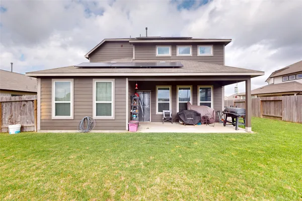 a view of a house with a yard porch and sitting area