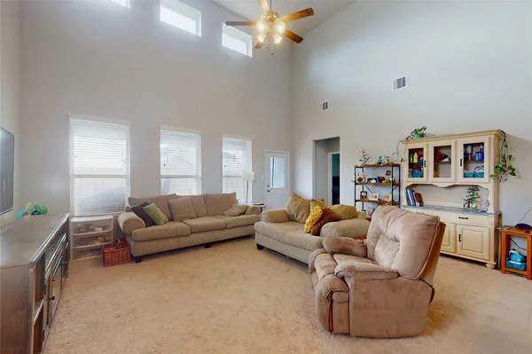 a living room with furniture and a couch