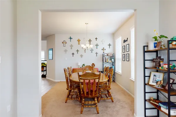 a dining room with furniture and window
