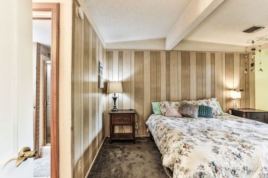 541 South Allen Street Ridgecrest, CA 93555 - Photo 23 of 41 a bedroom with a bed and a mirror