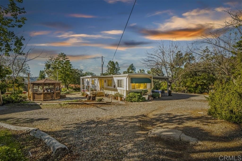 28909 Lilac Road Valley Center, CA 92082 - Photo 1 of 1 a view of a house with a yard
