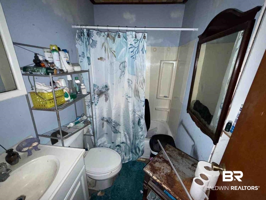 4117 Rebecca Road Mobile, AL 36609 - Photo 6 of 6 Full bath featuring toilet, shower / bath combo with shower curtain, and vanity