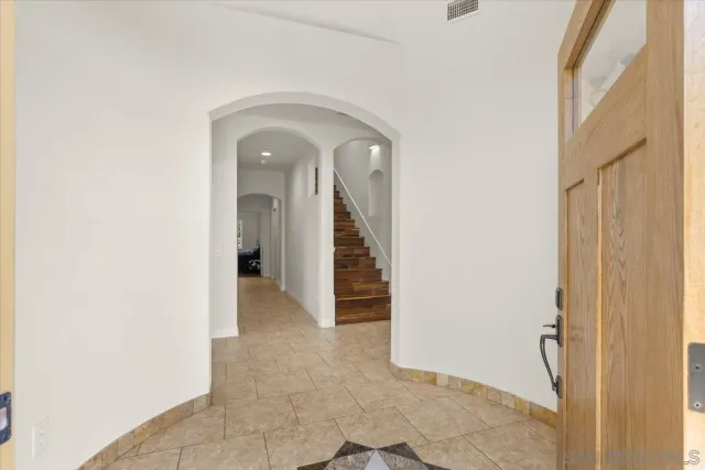 a view of a hallway view with staircase