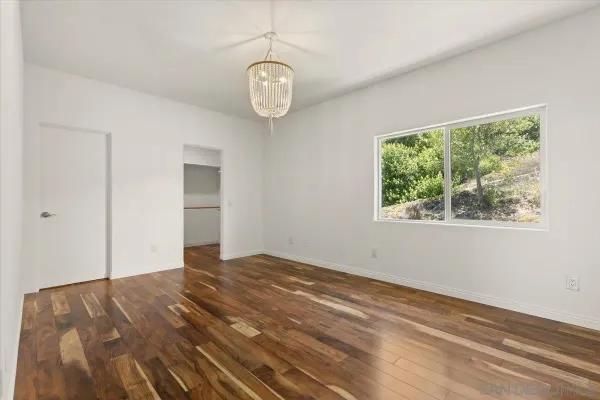 a couple of flower plants in front of house