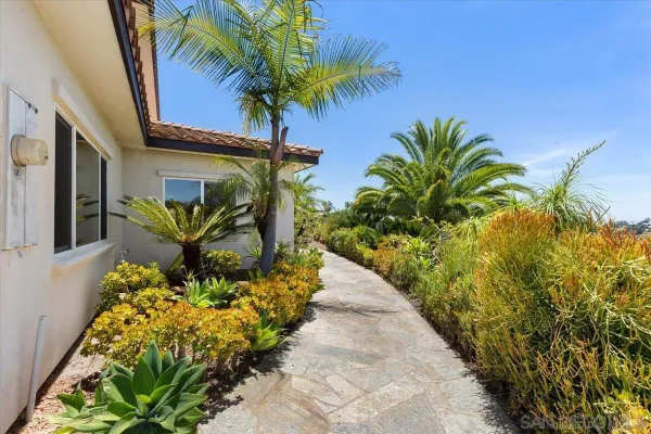 an aerial view of a house with a big yard