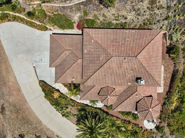 an aerial view of a house with a garden