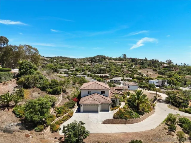 an aerial view of a house with a garden