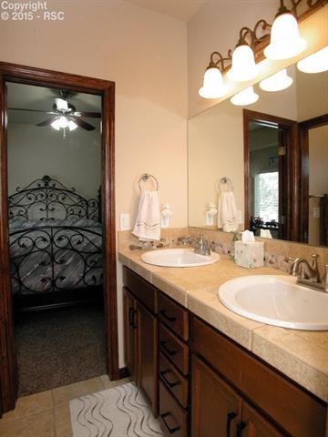 9863 Rockingham Drive Peyton, CO 80831 - Photo 14 of 21 Jack & Jill bath with raised counters.