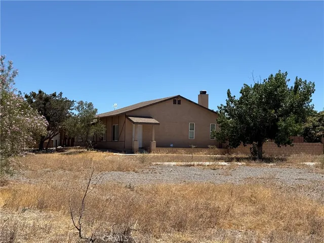 a house with trees in the background