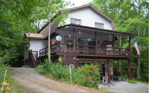 838 Cindy Cove Road Blairsville, GA 30512 - Photo 1 of 1 a front view of a house with garden