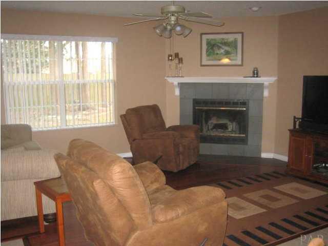 848 Copper Ridge Court Cantonment, FL 32533 - Photo 8 of 23 GREAT ROOM WITH FIREPLACE AND HARDWOOD FLOORS