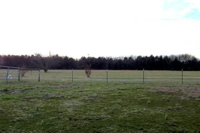 Great views surround this spacious home. Large hayfield.