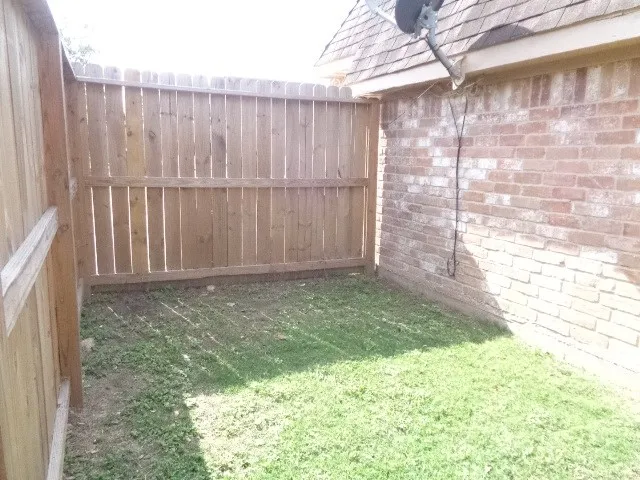 a view of outdoor space with a fence