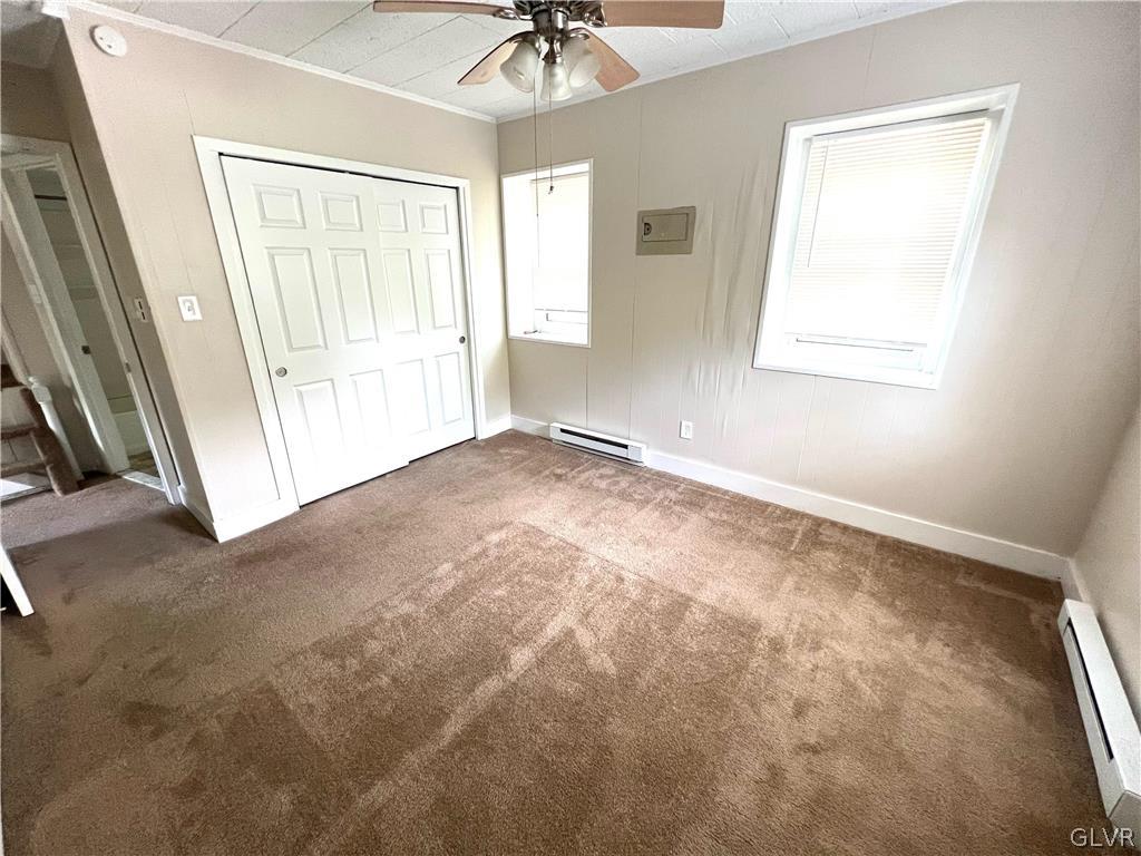 4001 Indian Creek Road Emmaus, PA 18049 - Photo 11 of 21 an empty room with a window and a ceiling fan