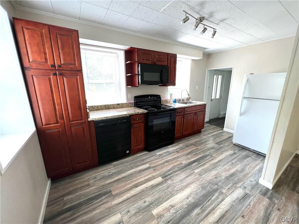 4001 Indian Creek Road Emmaus, PA 18049 - Photo 4 of 21 a kitchen with stainless steel appliances granite countertop a refrigerator stove and sink