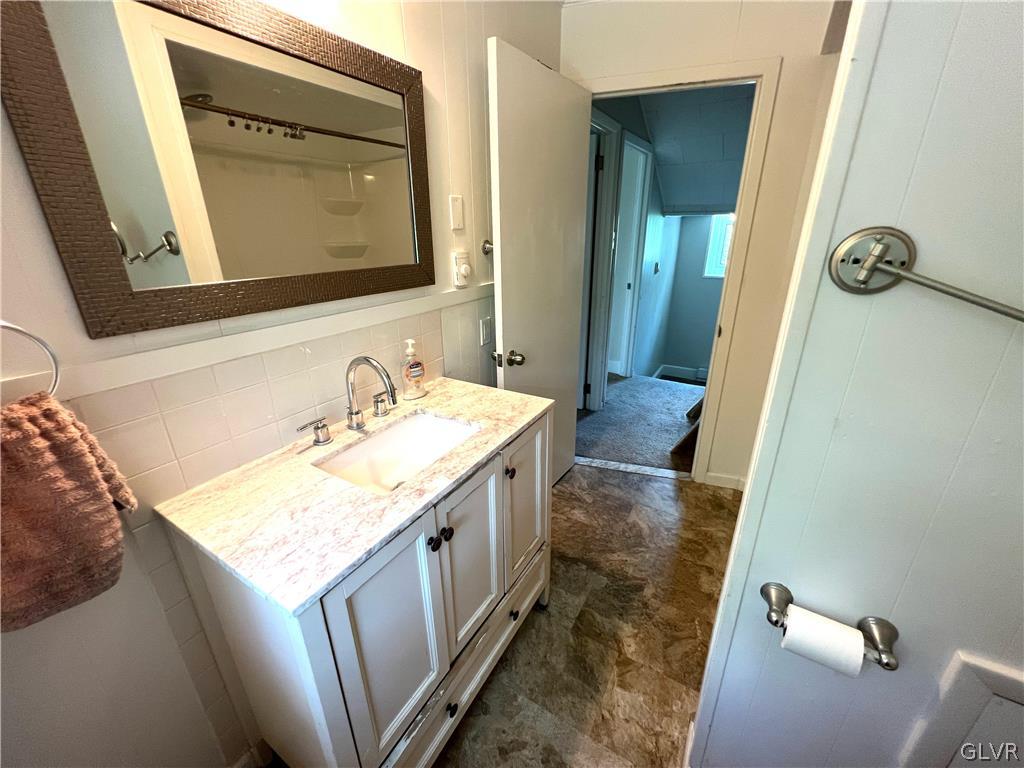 4001 Indian Creek Road Emmaus, PA 18049 - Photo 5 of 21 a bathroom with a granite countertop sink and a mirror
