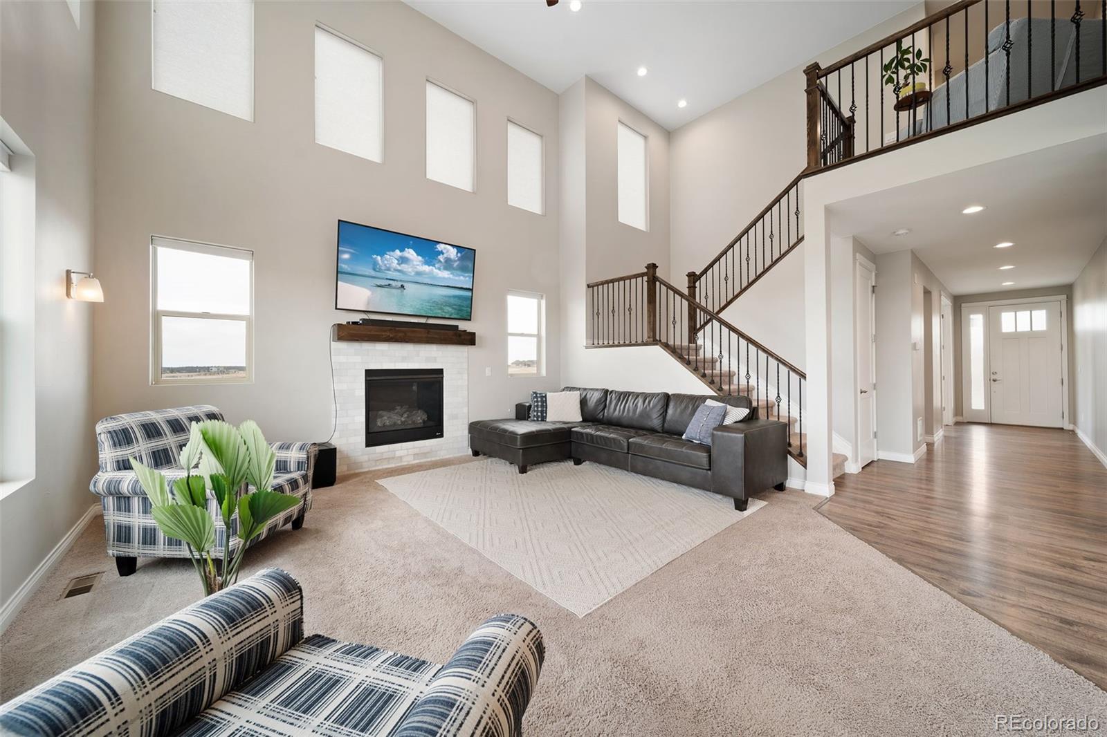 240 High Meadows Loop Elizabeth, CO 80107 - Photo 14 of 50 a living room with furniture and a fireplace