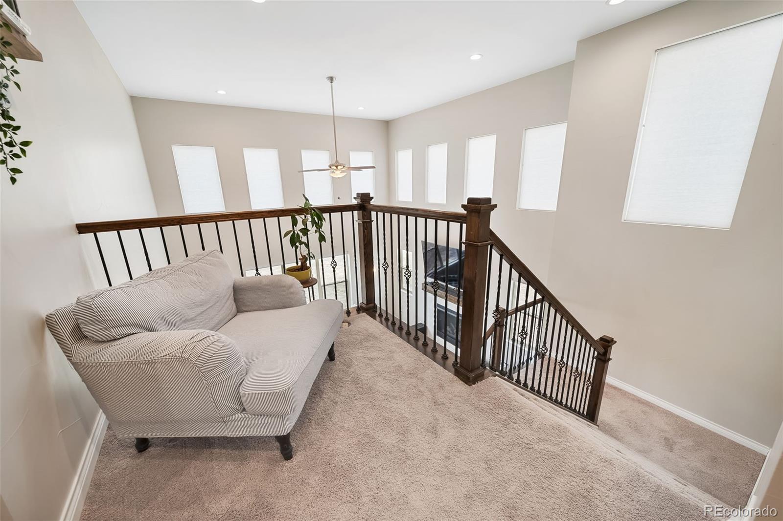 240 High Meadows Loop Elizabeth, CO 80107 - Photo 28 of 50 a view of a hallway with a couch